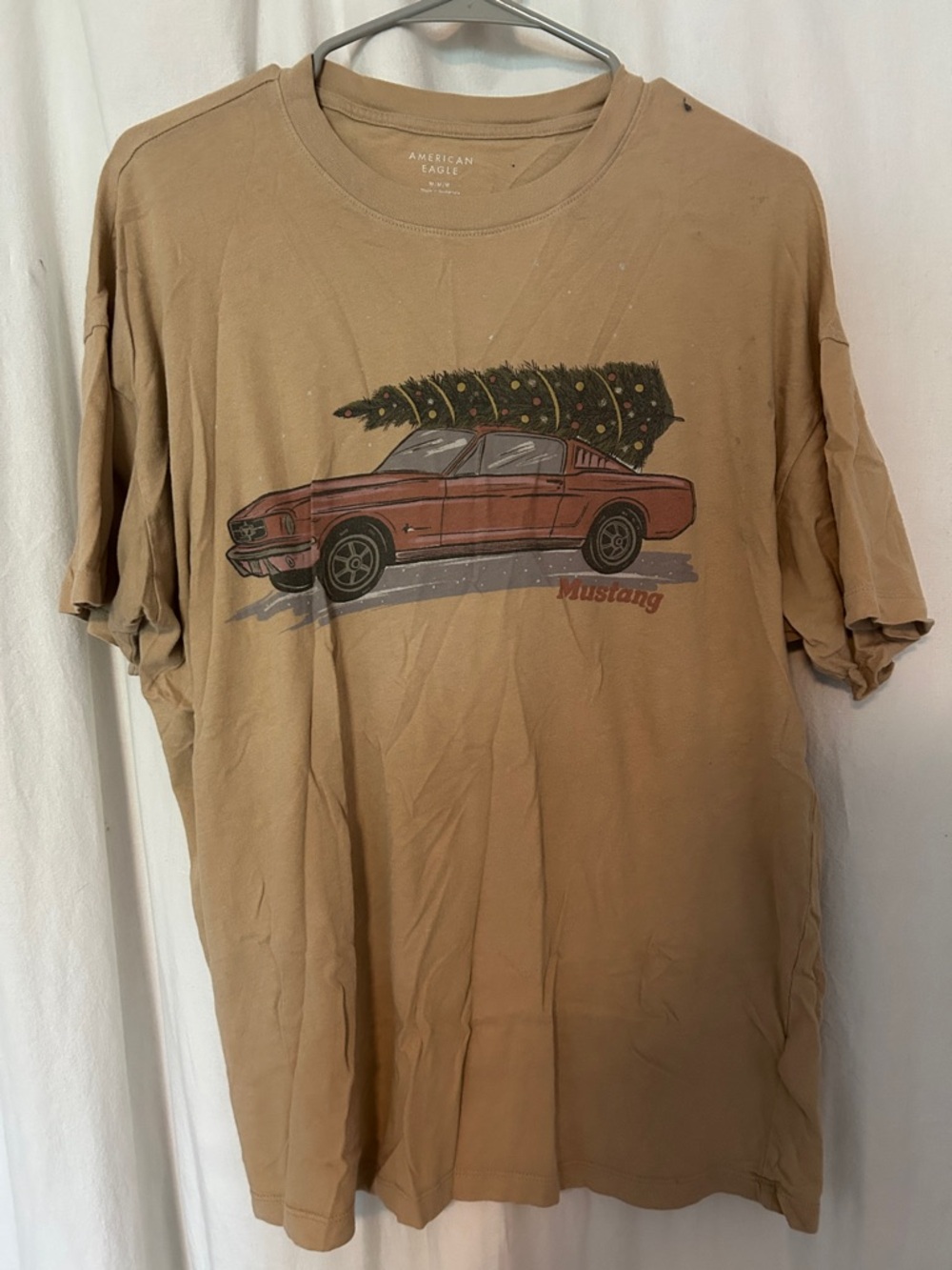 American Eagle Outfitters Tan Tee with Red Mustang and Green Tree Graphic